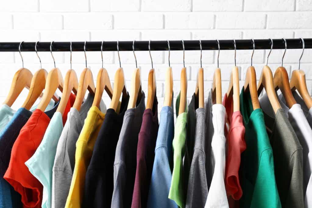 image of shirts hanging neatly in a closet